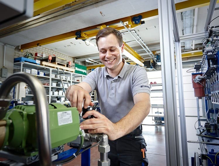 Worker Adjusting Electrical Engine Image Text